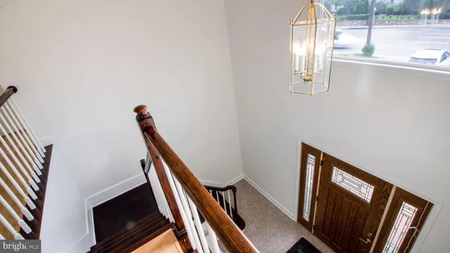a view of an empty room with stairs