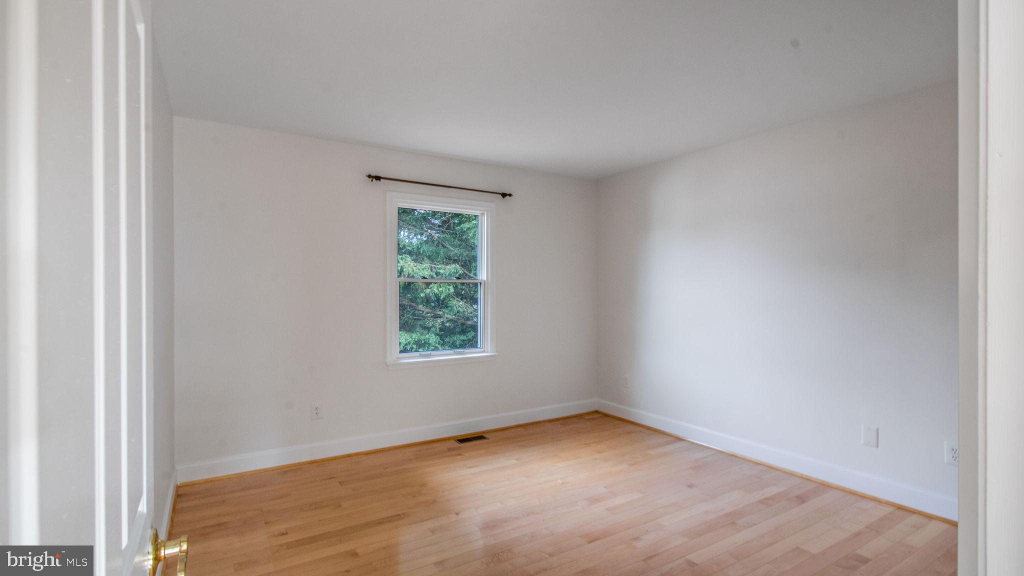 8933 Colesville Road Silver Spring, MD 20910 - Photo 19 of 31 an empty room with a window