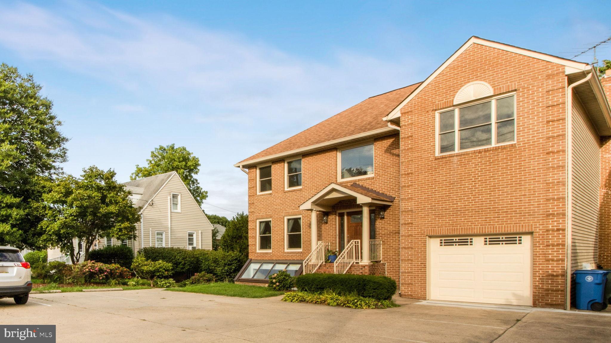 8933 Colesville Road Silver Spring, MD 20910 - Photo 2 of 31 a front view of a house with a yard