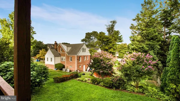 aerial view of a house with a yard