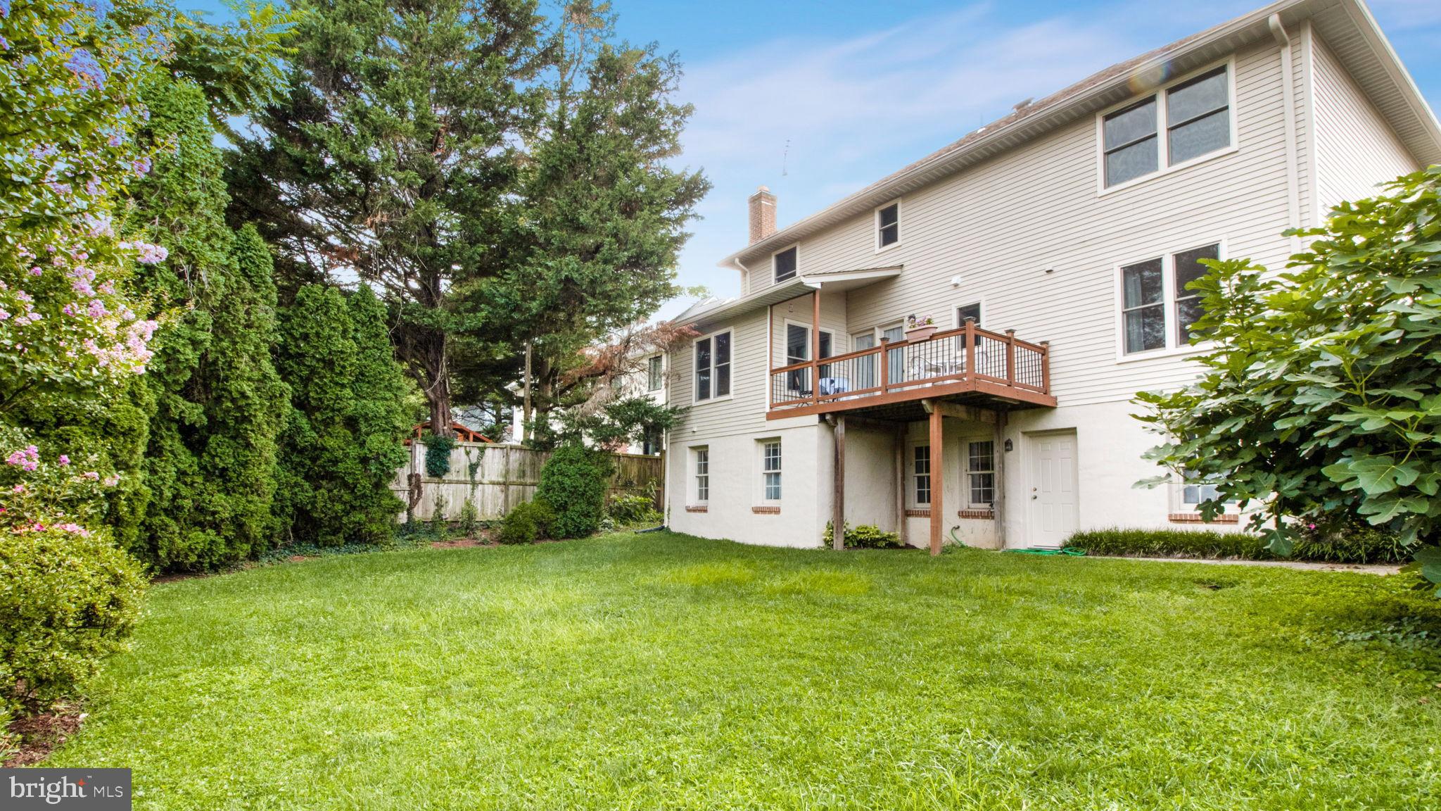 8933 Colesville Road Silver Spring, MD 20910 - Photo 27 of 31 a white house that has a tree in front of it