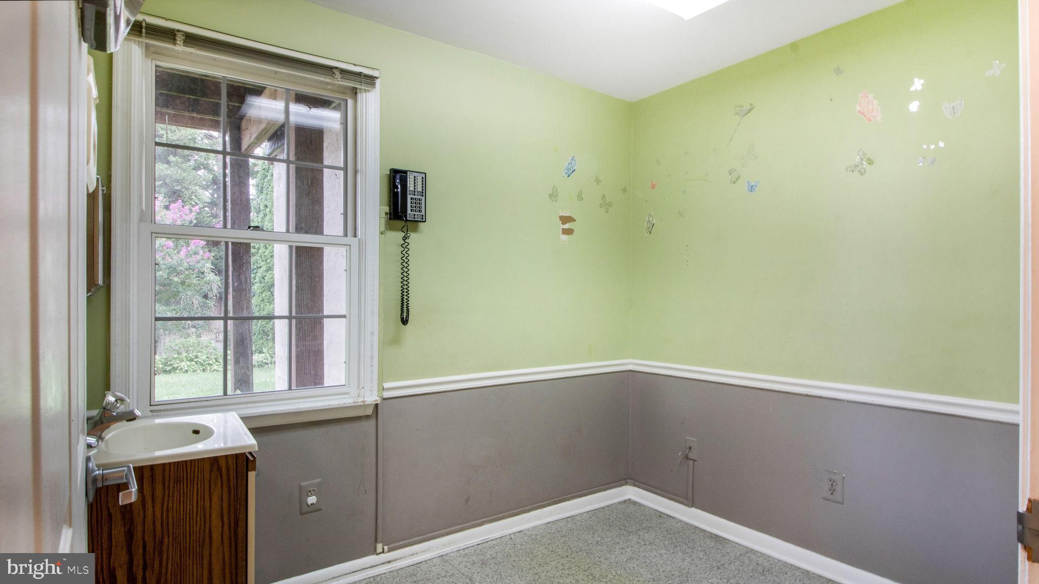 8933 Colesville Road Silver Spring, MD 20910 - Photo 29 of 31 a view of empty room with windows