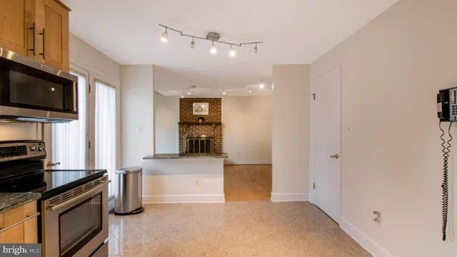a view of a kitchen with a sink and dishwasher cabinets