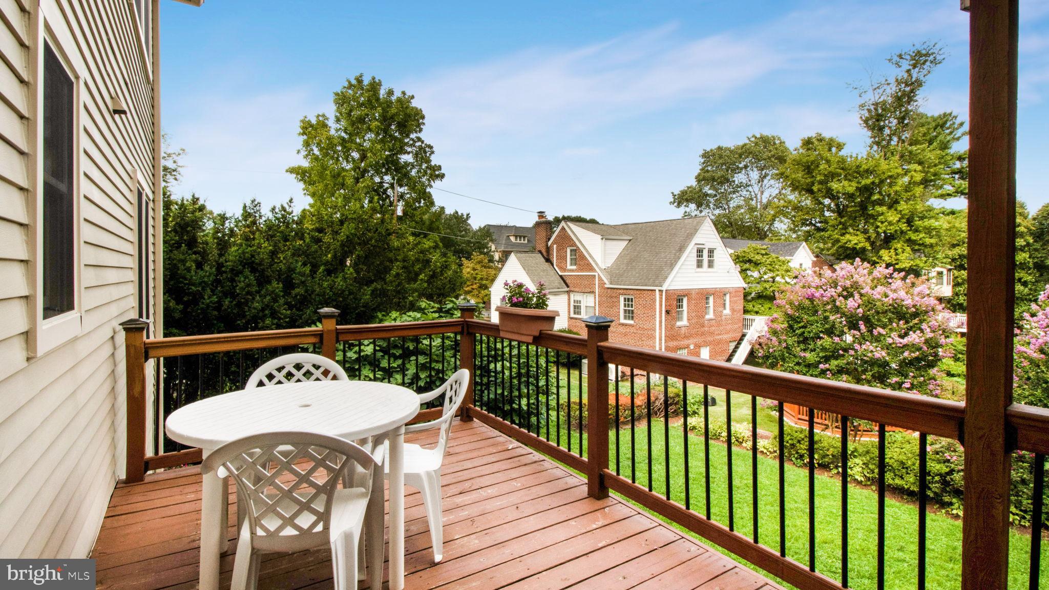 8933 Colesville Road Silver Spring, MD 20910 - Photo 7 of 31 a view of a balcony with wooden floor and outdoor seating