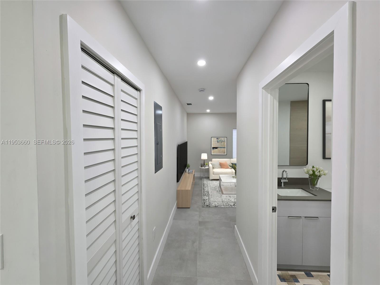 765 Northwest 45th Street Miami, FL 33127 - Photo 29 of 46 a view of a hallway with bathroom and a sink