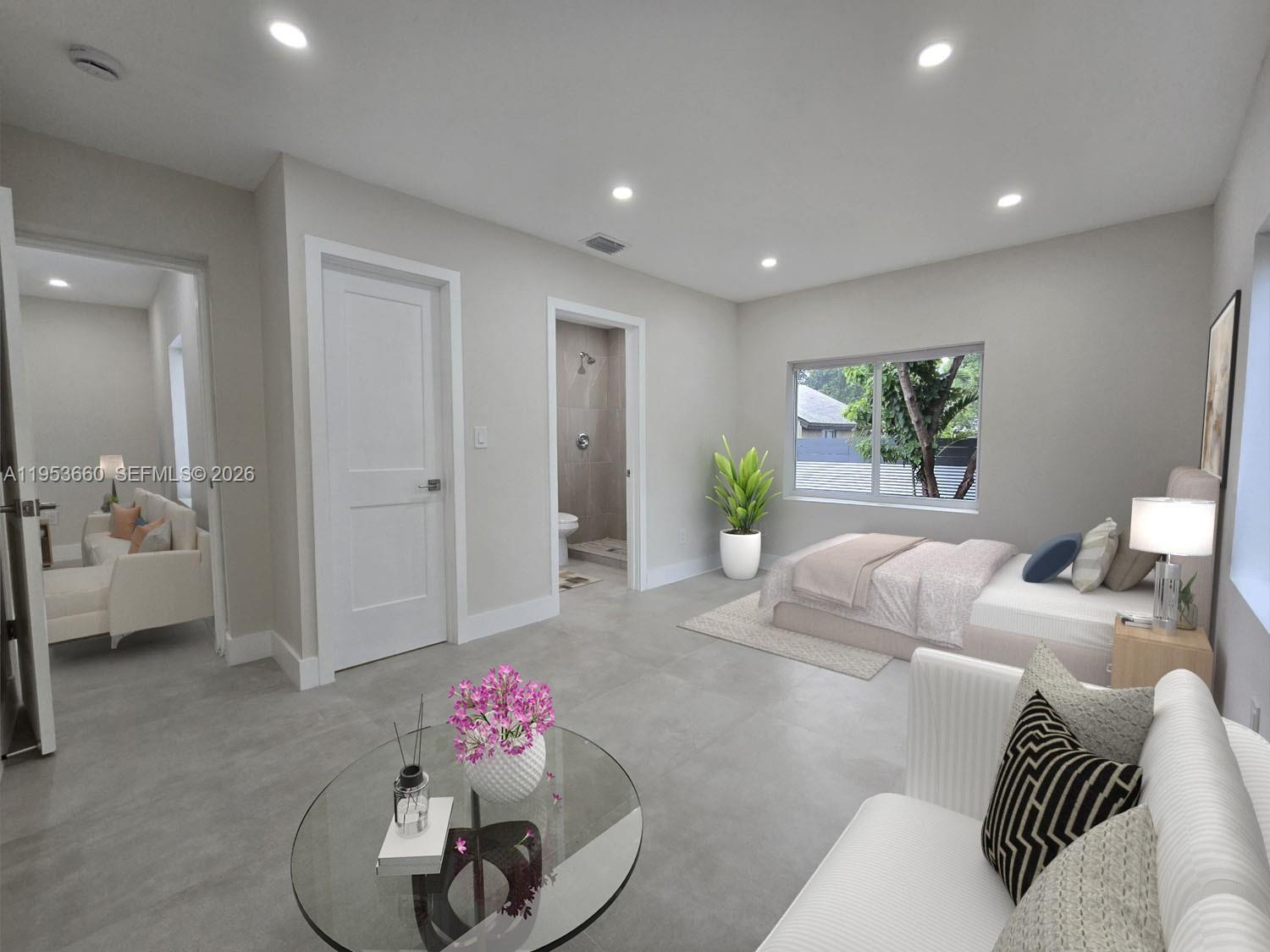 765 Northwest 45th Street Miami, FL 33127 - Photo 36 of 46 a living room with furniture and a chandelier