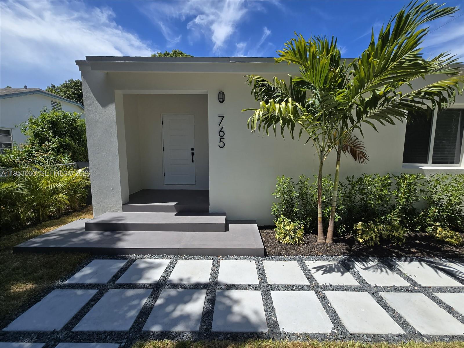 765 Northwest 45th Street Miami, FL 33127 - Photo 7 of 46 a view of a house with a yard