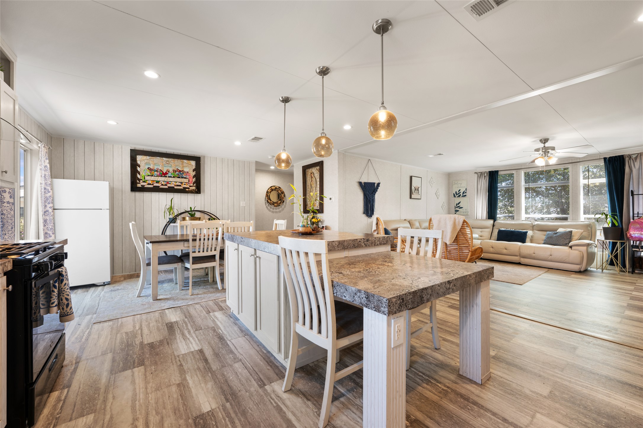 113 Sunflower Road Dale, TX 78616 - Photo 33 of 33 An open floor plan seamlessly connects the central kitchen island to surrounding living spaces.