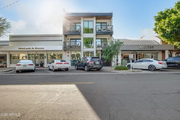 a view of a cars parked in front of a building