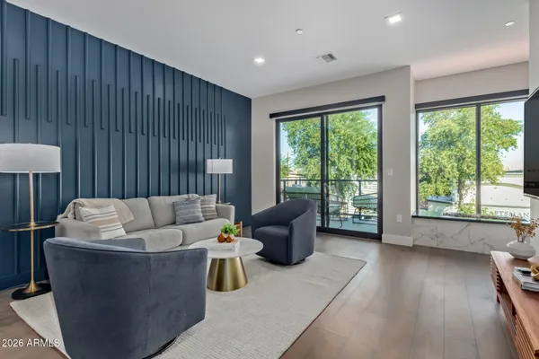 a living room with furniture and a large window