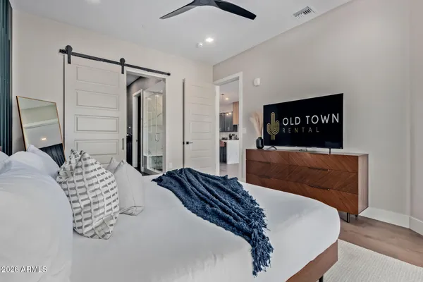 a bedroom with a bed and a walk in closet