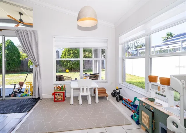 a large kitchen with stainless steel appliances lots of counter space sink and a window