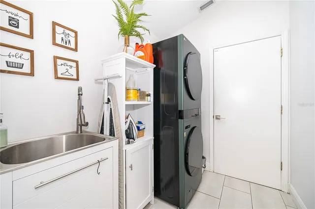 a bedroom with a bed window and a flat screen tv