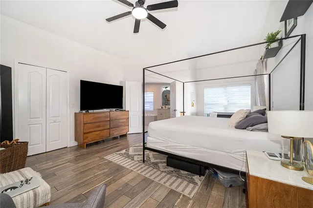 a spacious bathroom with a double vanity sink a mirror a bathtub and a shower