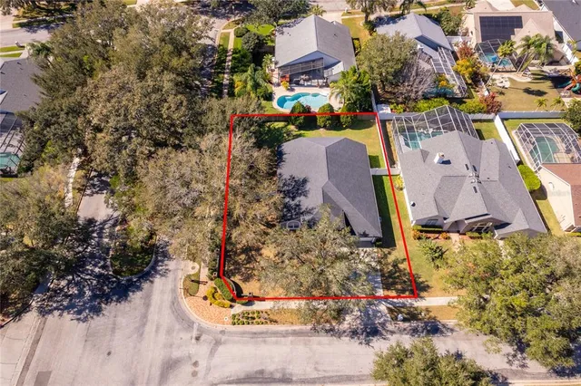 a aerial view of a house with a yard and garden
