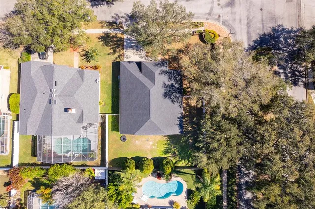 an aerial view of a house with a yard and garden