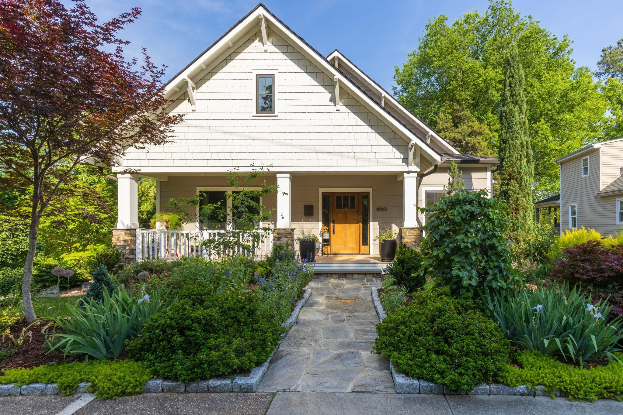 1610 Bickett Boulevard Raleigh, NC 27608 - Photo 1 of 44 a front view of house with a garden