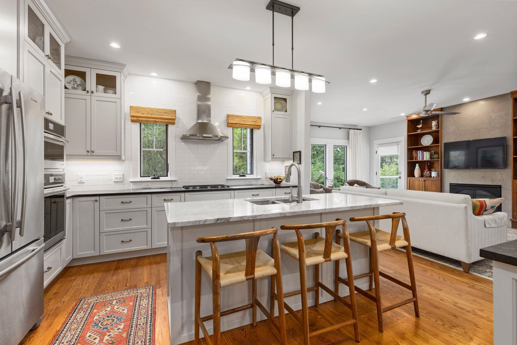 1610 Bickett Boulevard Raleigh, NC 27608 - Photo 18 of 44 a large kitchen with granite countertop lots of counter space and window