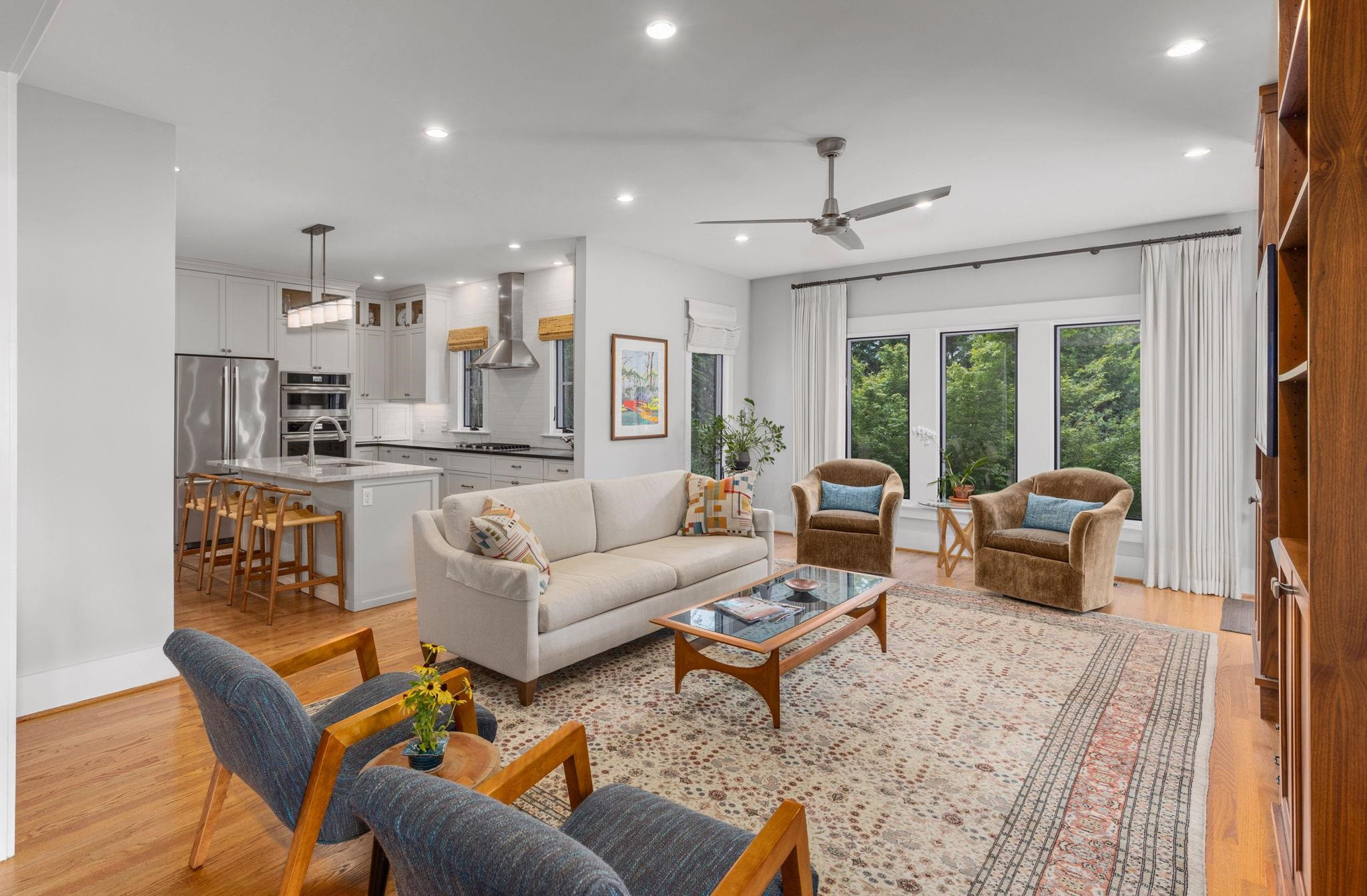 1610 Bickett Boulevard Raleigh, NC 27608 - Photo 19 of 44 a living room with furniture and a large window