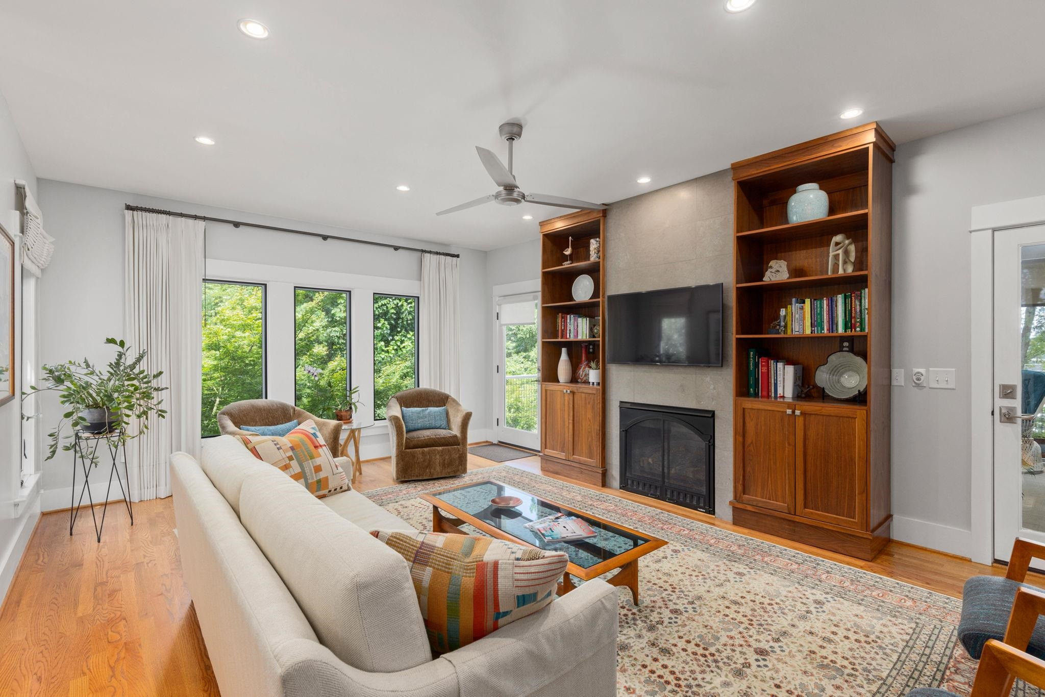 1610 Bickett Boulevard Raleigh, NC 27608 - Photo 20 of 44 a living room with furniture fireplace and flat screen tv