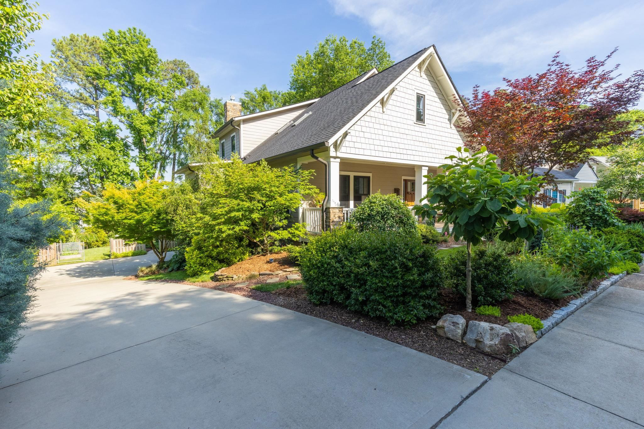 1610 Bickett Boulevard Raleigh, NC 27608 - Photo 2 of 44 a front view of a house with a yard and garage