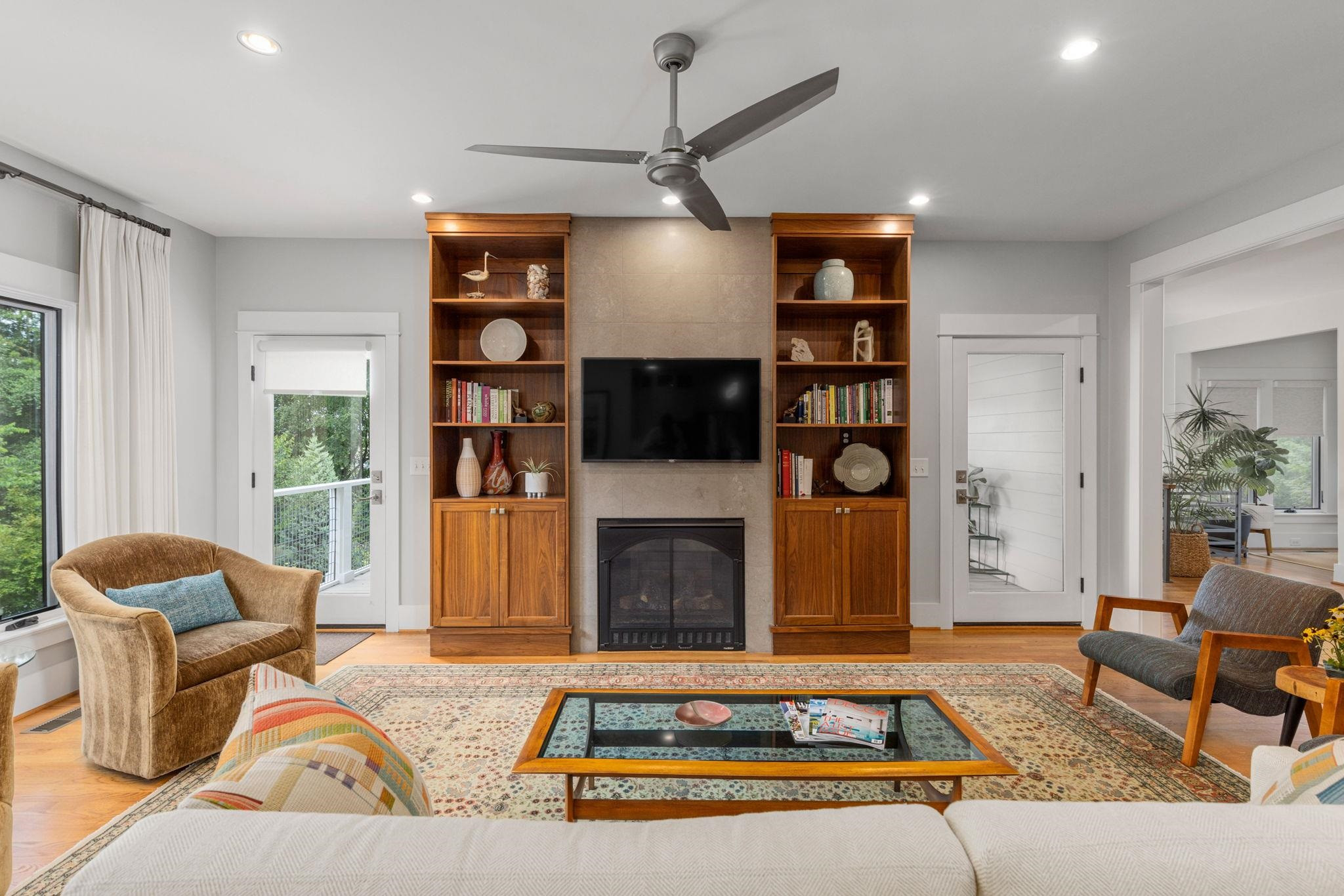 1610 Bickett Boulevard Raleigh, NC 27608 - Photo 21 of 44 a living room with fireplace furniture and a flat screen tv
