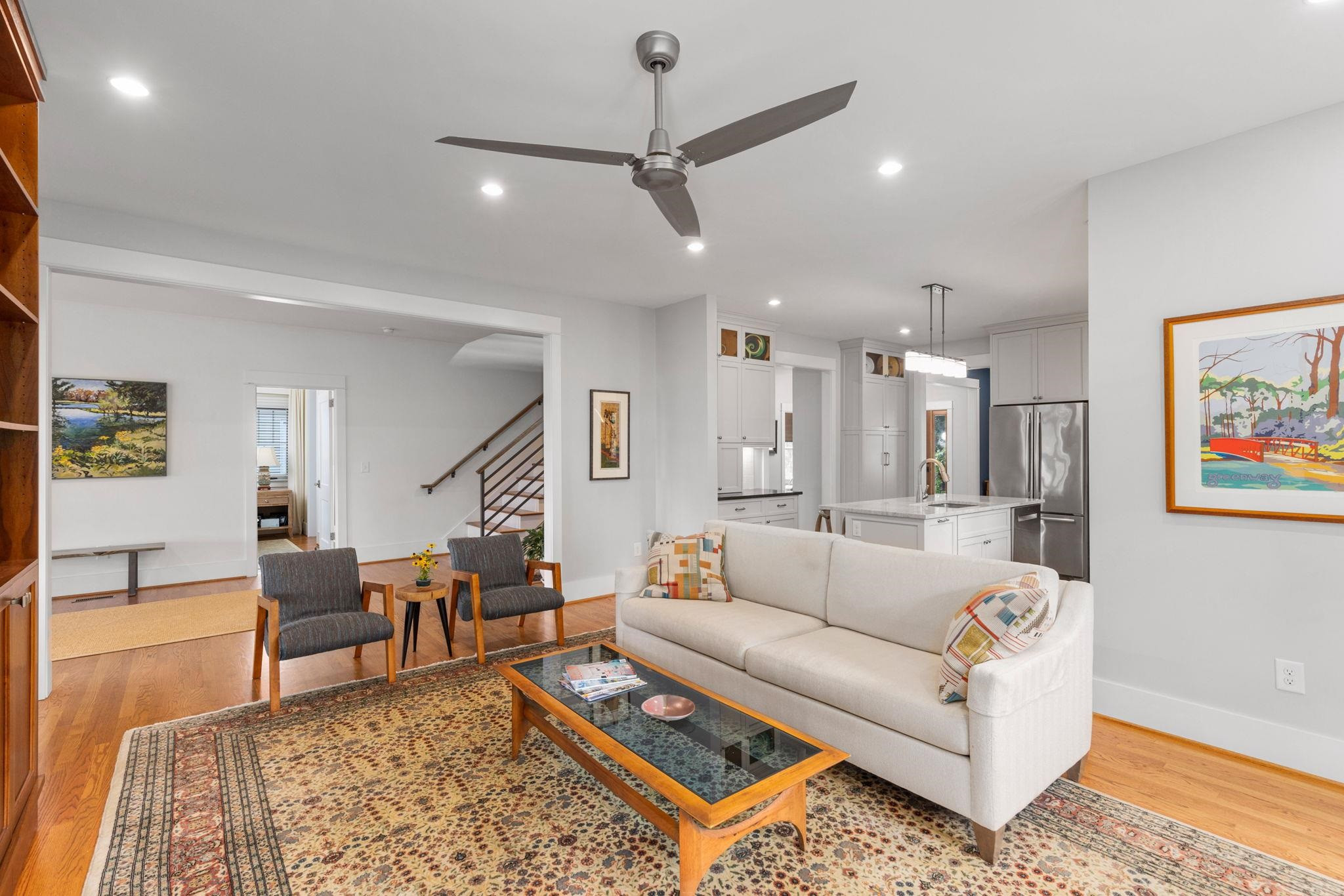 1610 Bickett Boulevard Raleigh, NC 27608 - Photo 22 of 44 a living room with furniture and a rug