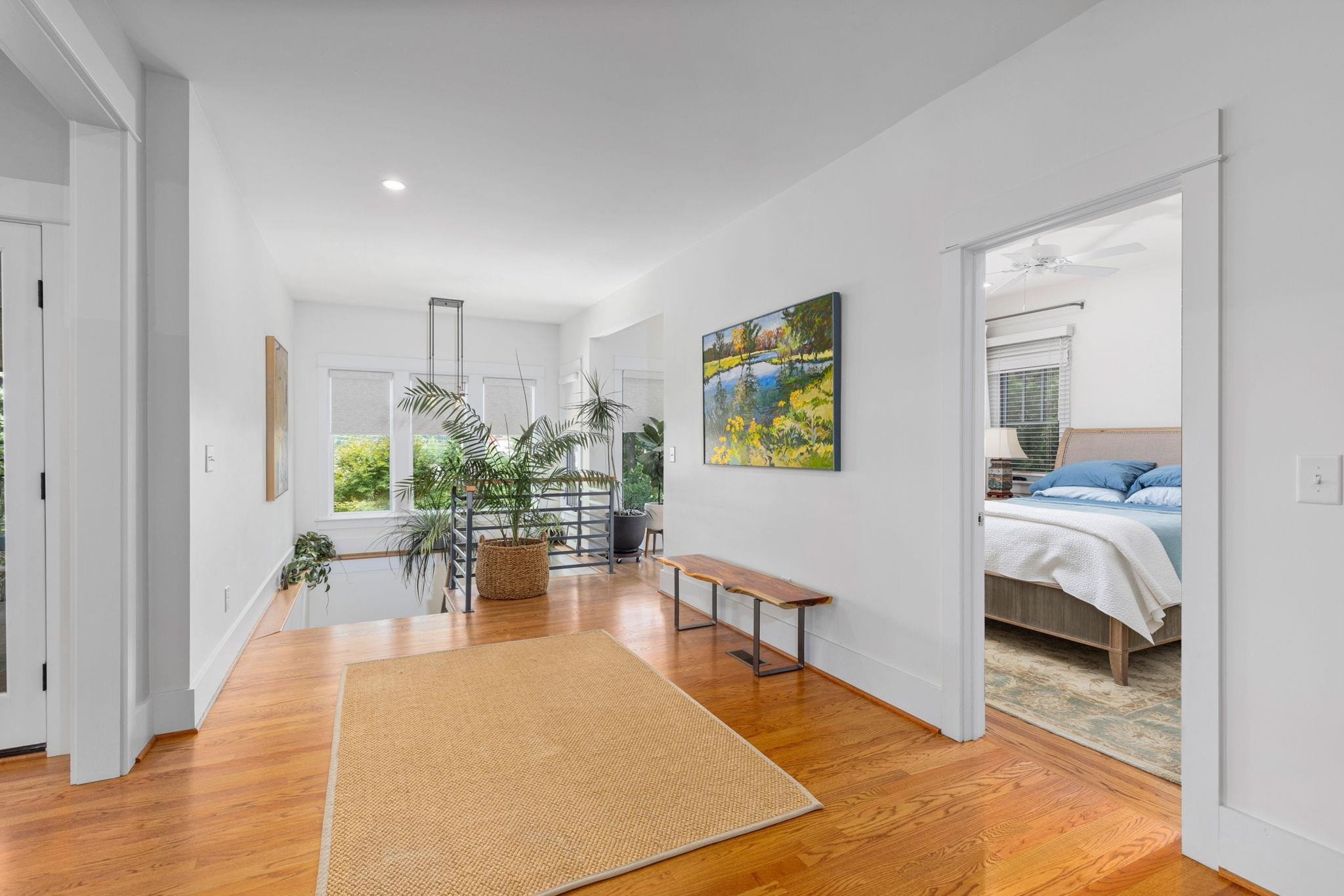1610 Bickett Boulevard Raleigh, NC 27608 - Photo 23 of 44 a living room with furniture and a wooden floor