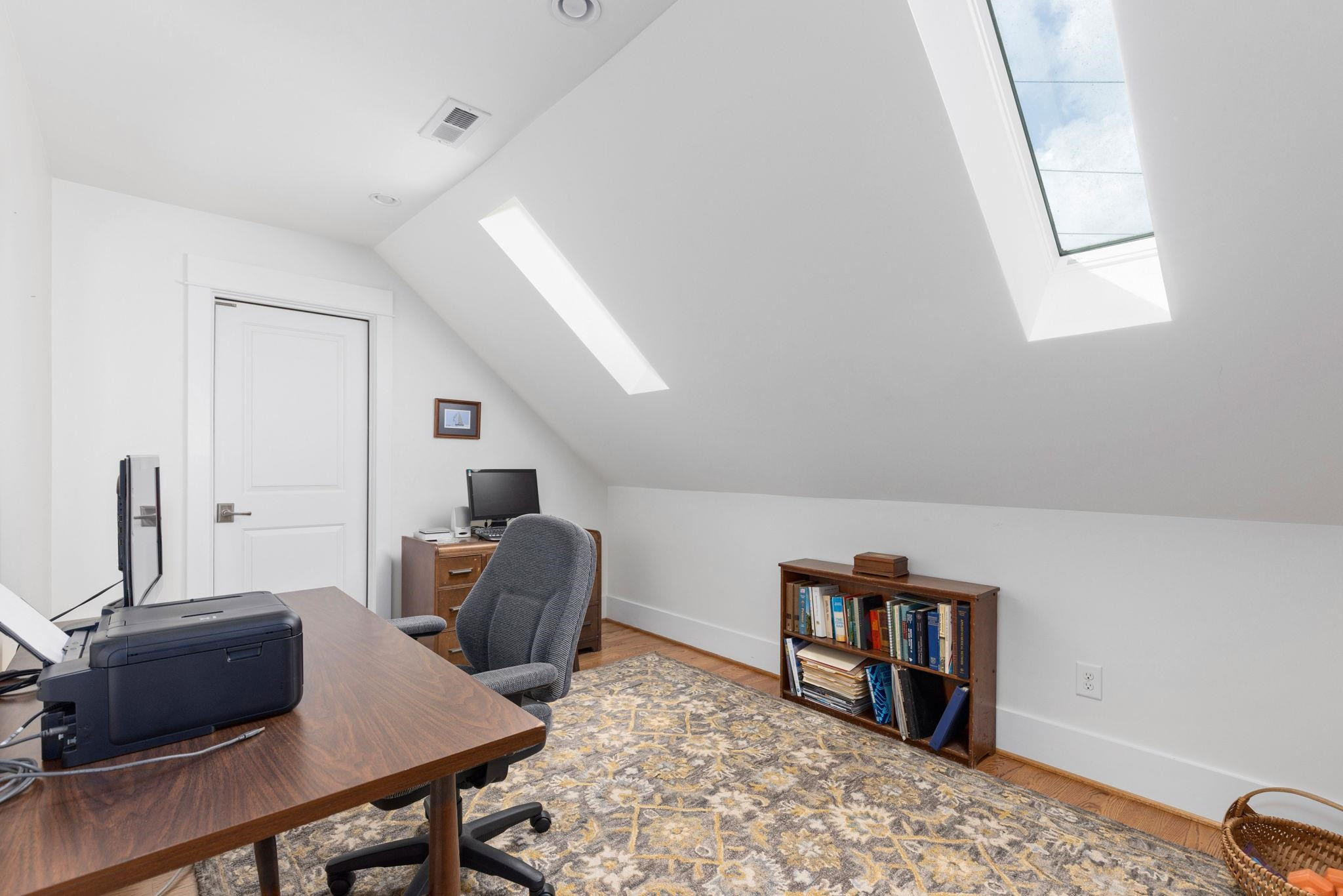 1610 Bickett Boulevard Raleigh, NC 27608 - Photo 31 of 44 a living room with furniture and a wooden floor