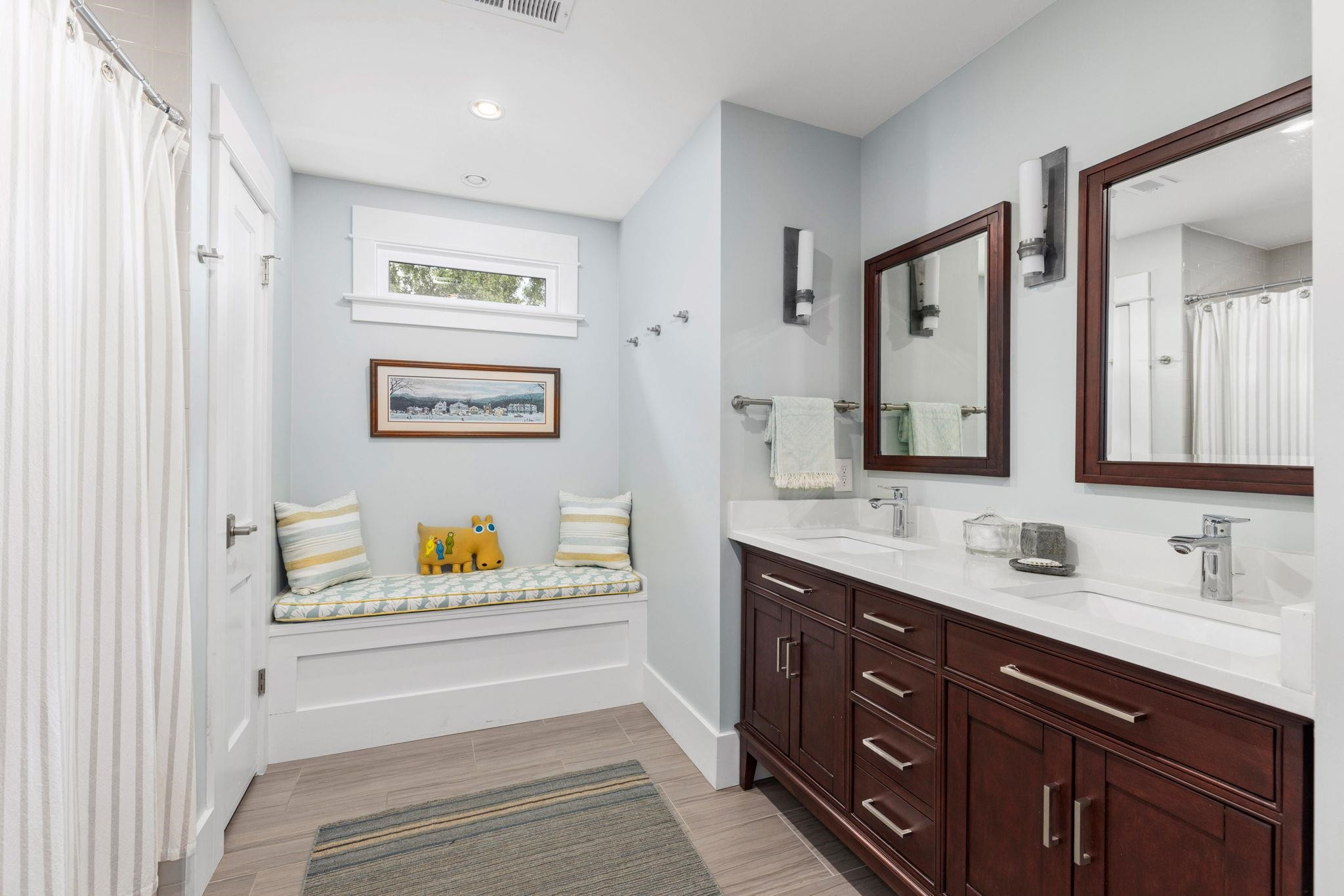 1610 Bickett Boulevard Raleigh, NC 27608 - Photo 32 of 44 a bathroom with double vanity sink and a bathtub