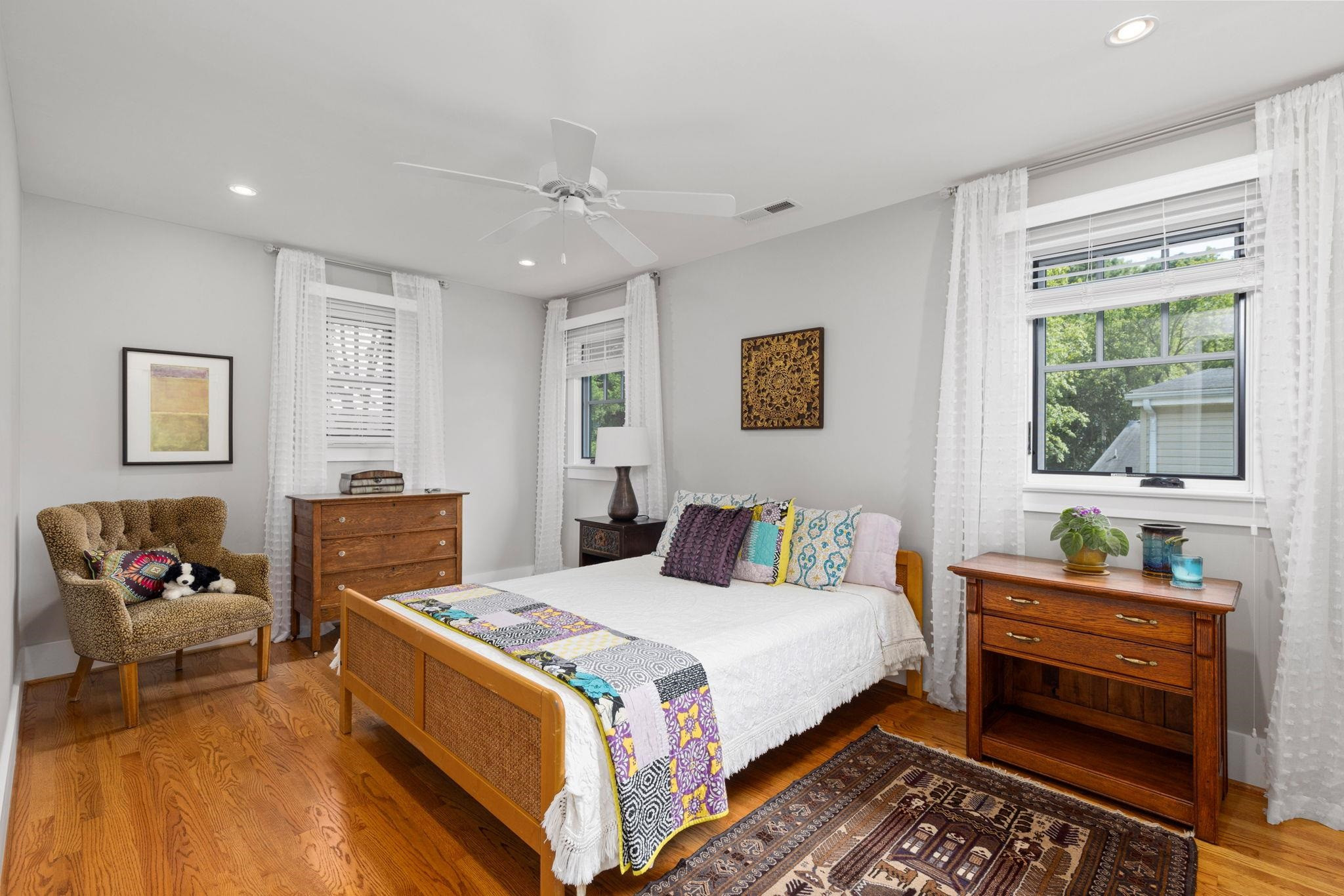 1610 Bickett Boulevard Raleigh, NC 27608 - Photo 33 of 44 a bedroom with a bed and wooden floor