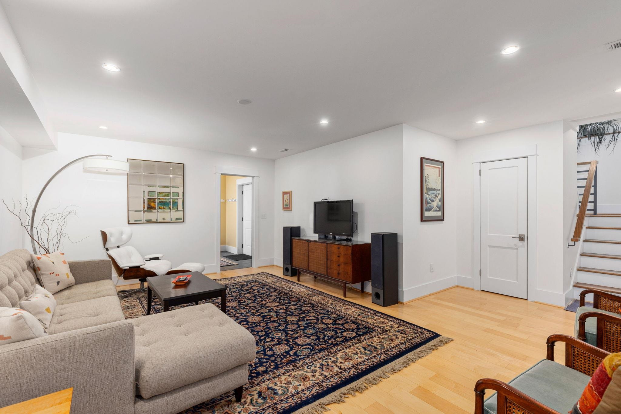1610 Bickett Boulevard Raleigh, NC 27608 - Photo 37 of 44 a living room with furniture and a flat screen tv