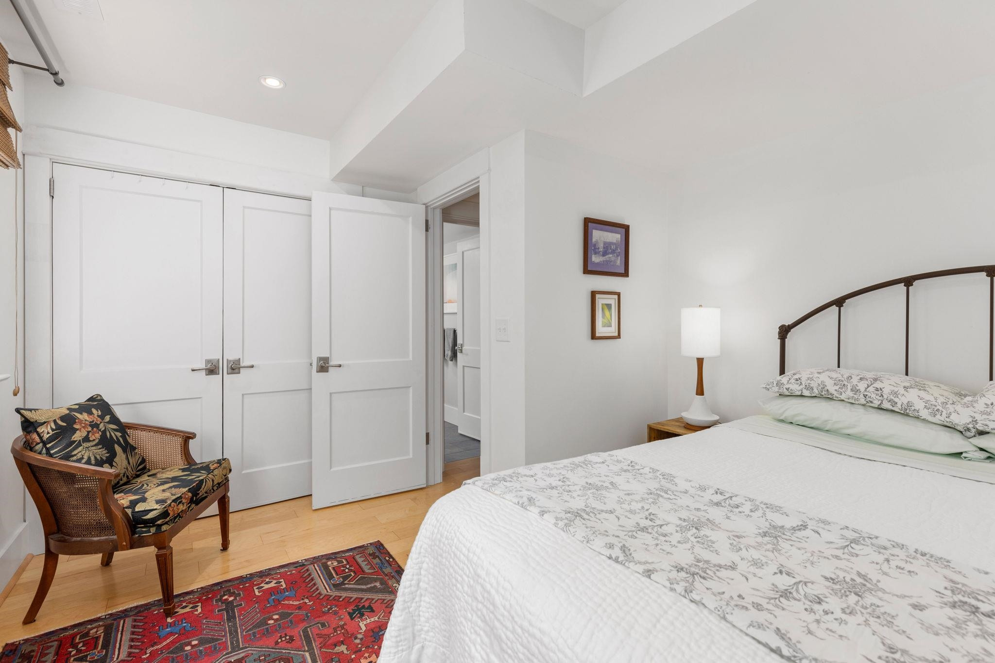 1610 Bickett Boulevard Raleigh, NC 27608 - Photo 39 of 44 a bedroom with a bed and chair