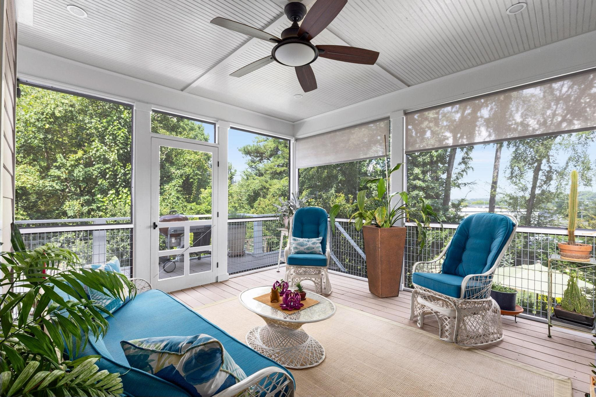 1610 Bickett Boulevard Raleigh, NC 27608 - Photo 44 of 44 a living room with furniture and a floor to ceiling window