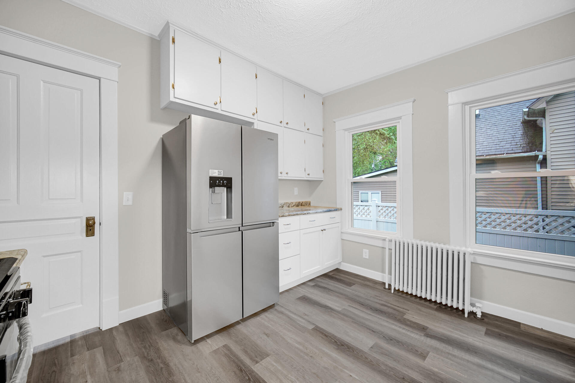 411 E Street La Porte, IN 46350 - Photo 12 of 33 a kitchen with stainless steel appliances a refrigerator and a stove top oven