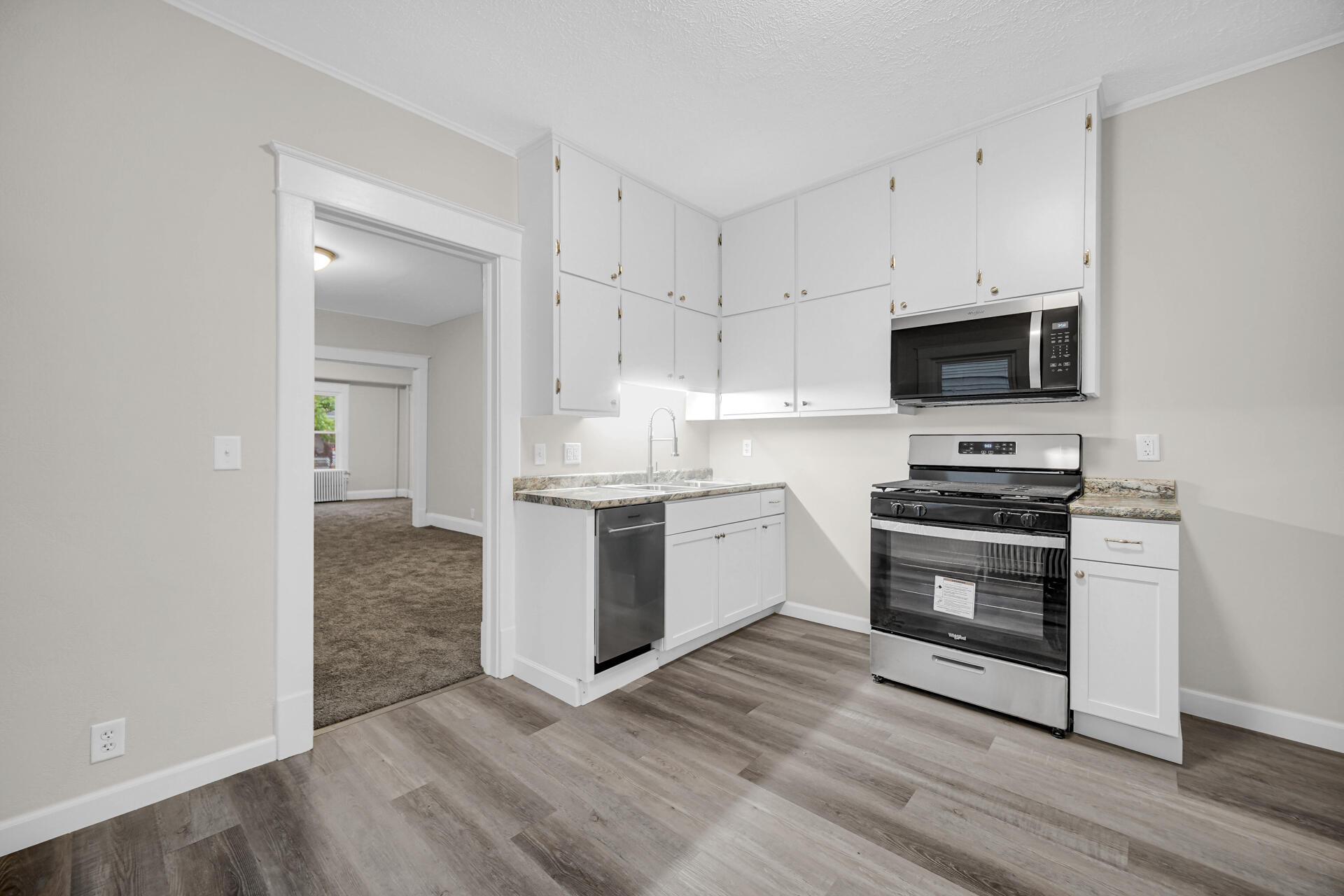 411 E Street La Porte, IN 46350 - Photo 15 of 33 a kitchen with a stove and a microwave