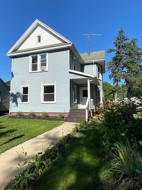 411 E Street La Porte, IN 46350 - Photo 2 of 33 a front view of a house with a yard