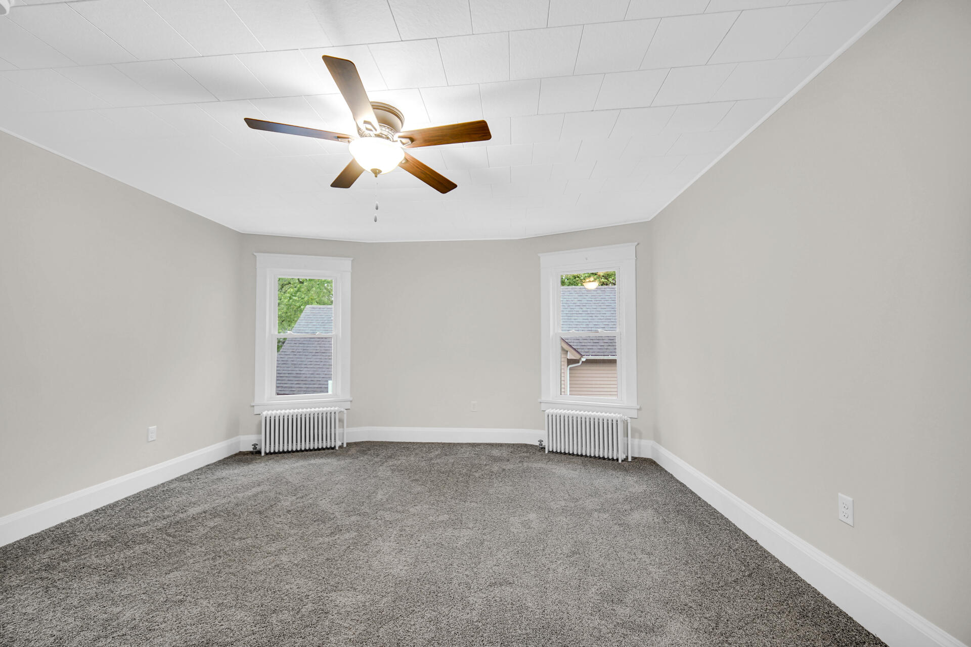 411 E Street La Porte, IN 46350 - Photo 25 of 33 an empty room with windows and fan