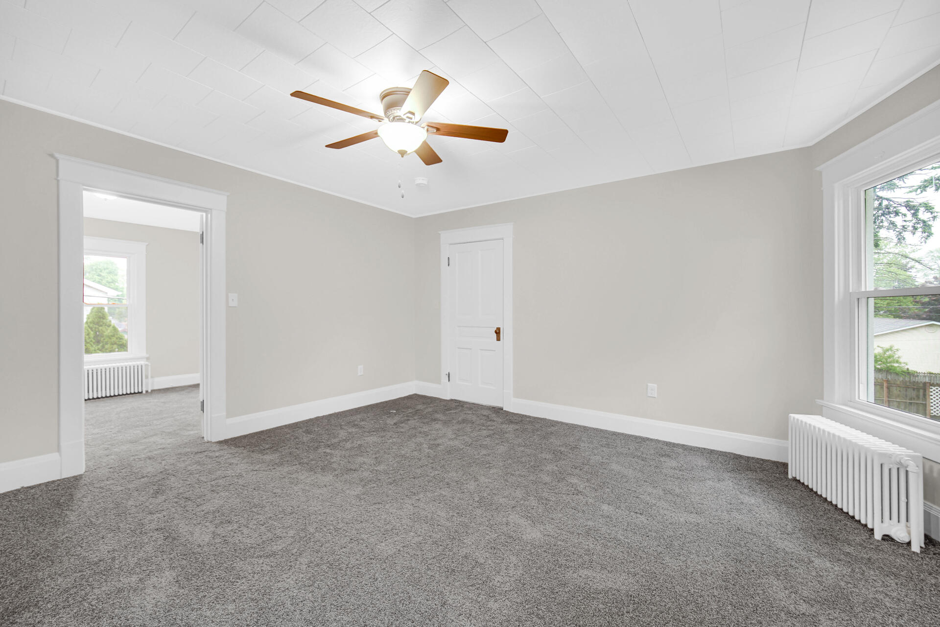 411 E Street La Porte, IN 46350 - Photo 26 of 33 an empty room with windows and fan