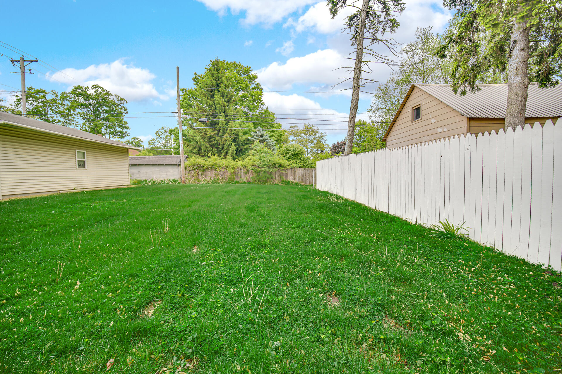411 E Street La Porte, IN 46350 - Photo 5 of 33 a view of a backyard with a garden and plants