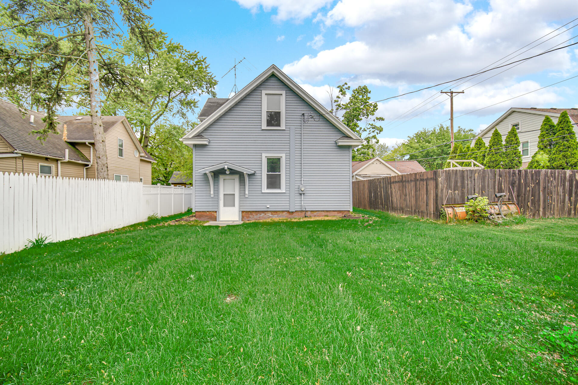 411 E Street La Porte, IN 46350 - Photo 6 of 33 a view of a house with a yard and a large tree