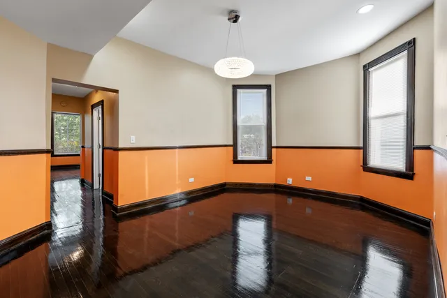 a view of a living room and chandelier