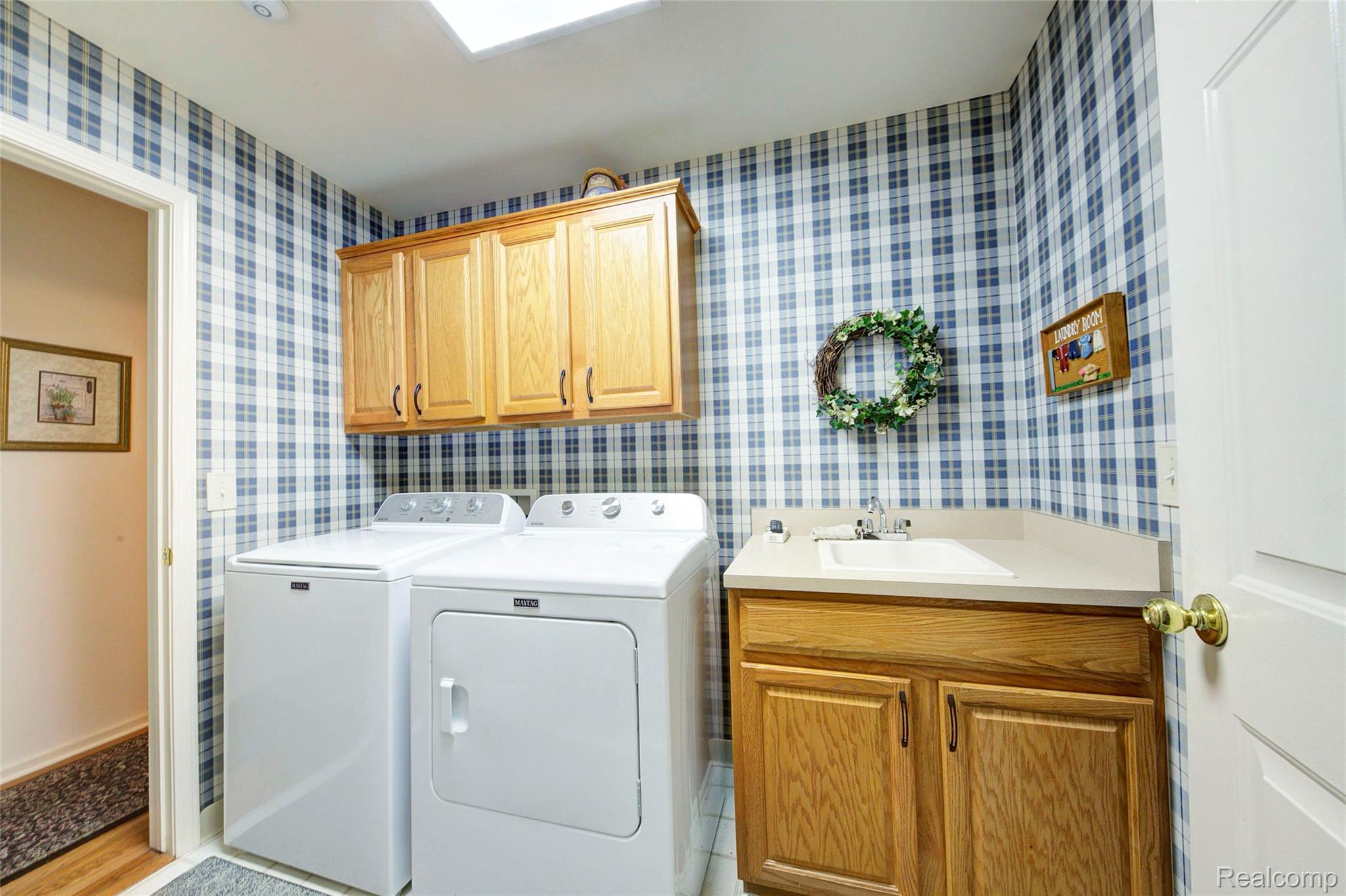 2577 Cleveland Way Canton, MI 48188 - Photo 20 of 34 Laundry room with separate washer and dryer and cabinet space