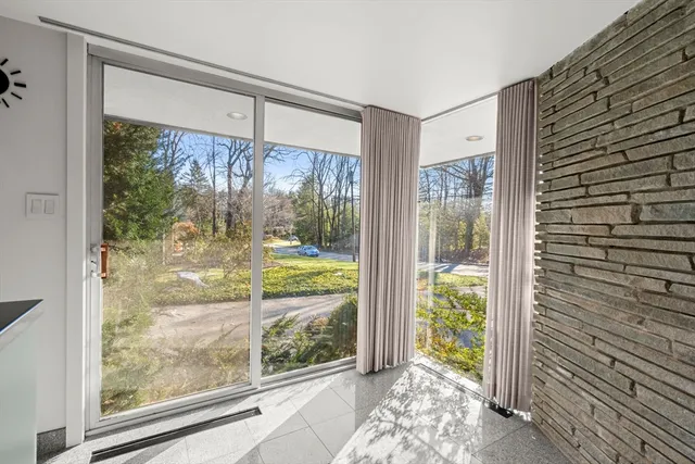 a kitchen with granite countertop a refrigerator and a counter top space