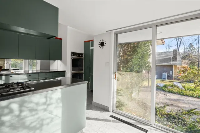 a room with wooden floor and a window