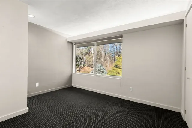 a room with window and cabinet