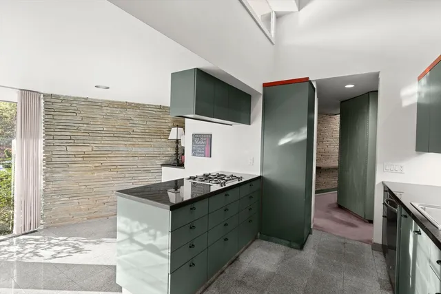 a kitchen with a sink and cabinets