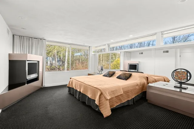 a view of a hallway with windows