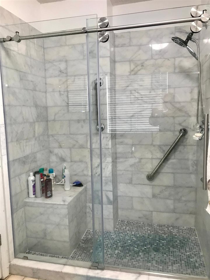 303 Pill Jerk Road Covington, TN 38019 - Photo 13 of 25 Nice walk in shower and has grab bars or handicap bars.