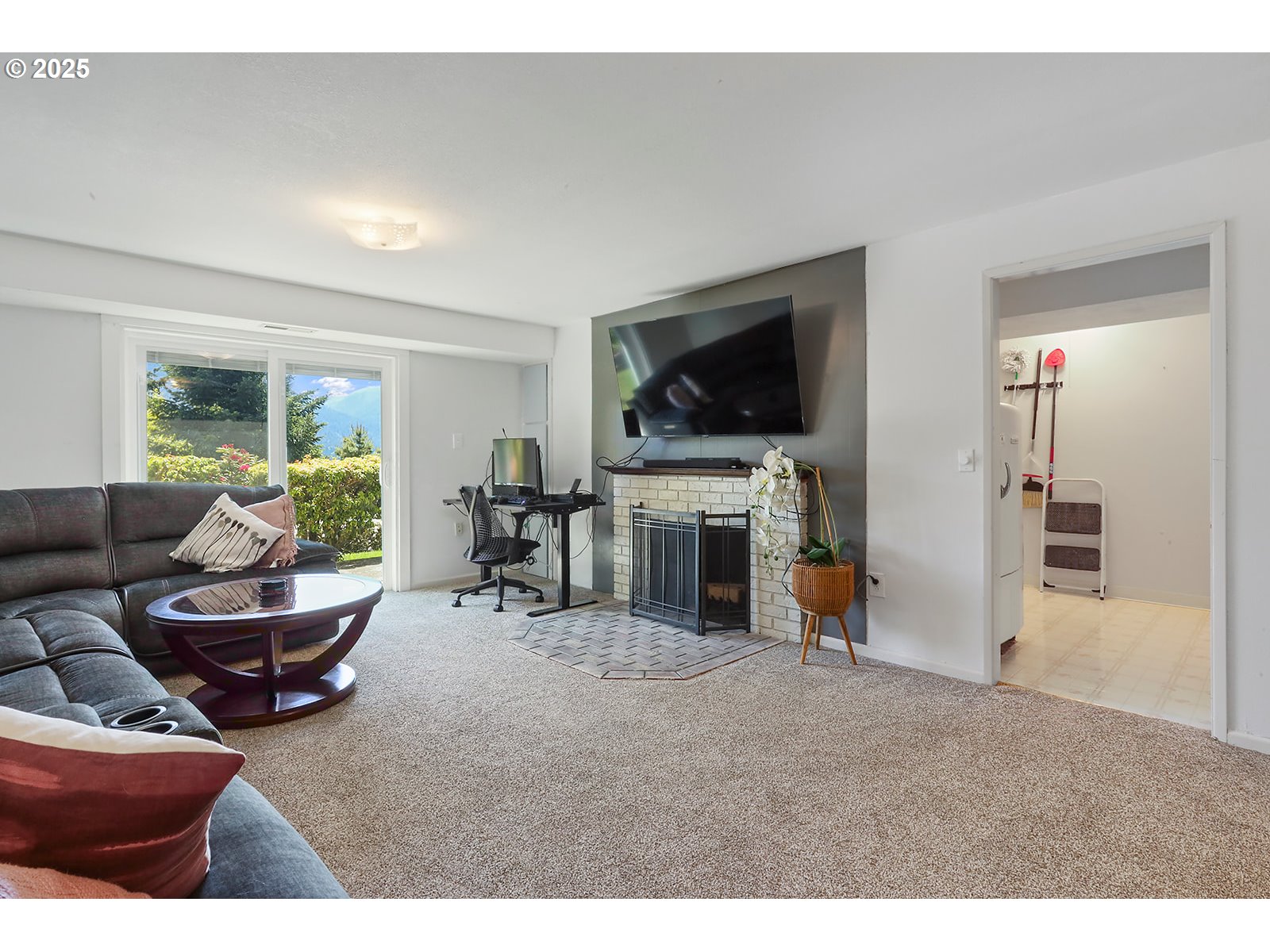 101 Allen Street Carson, WA 98610 - Photo 26 of 48 a living room with furniture and a flat screen tv